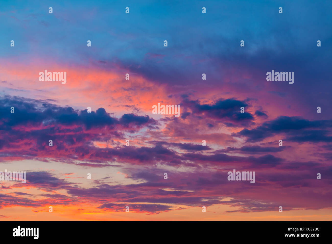 Beautiful cloudscape with colorful contrasting clouds at sunset Stock Photo