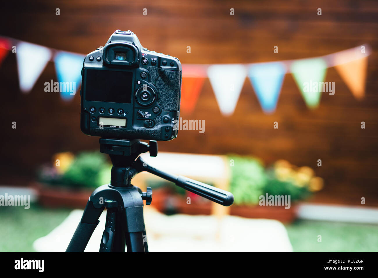Picture of digital camera placed on tripod Stock Photo