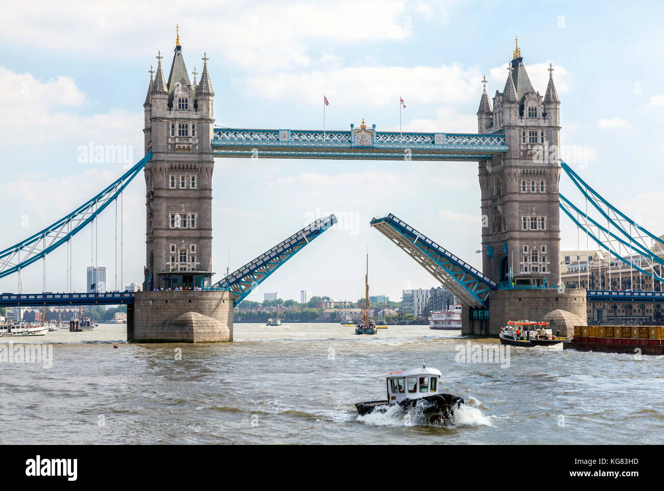Tower Bridge opening for tall Yacht to pass through. Stock Photo