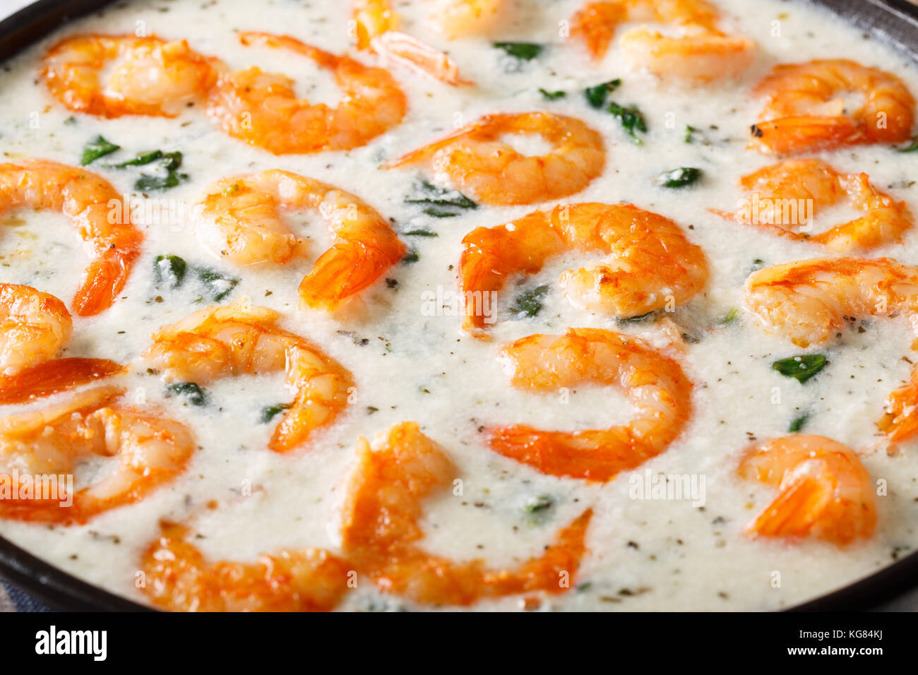 creamy garlic butter tuscan shrimp with spinach macro on a plate