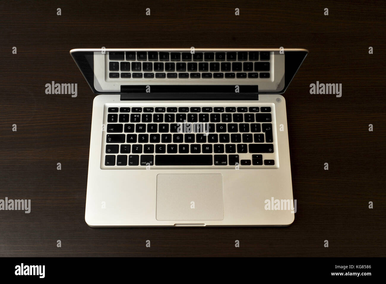 Photo of a Laptop on a dark background with fill light Stock Photo