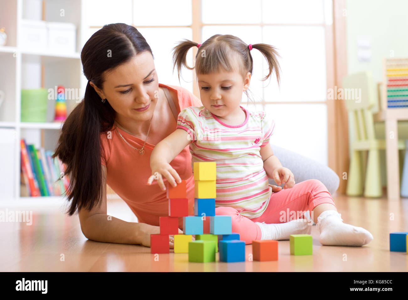 cute mother and child girl play together Stock Photo