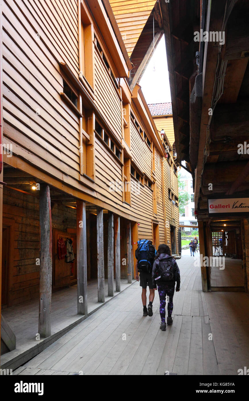 Backpackers in alley in Bryggen, Bergen, Norway Stock Photo Alamy