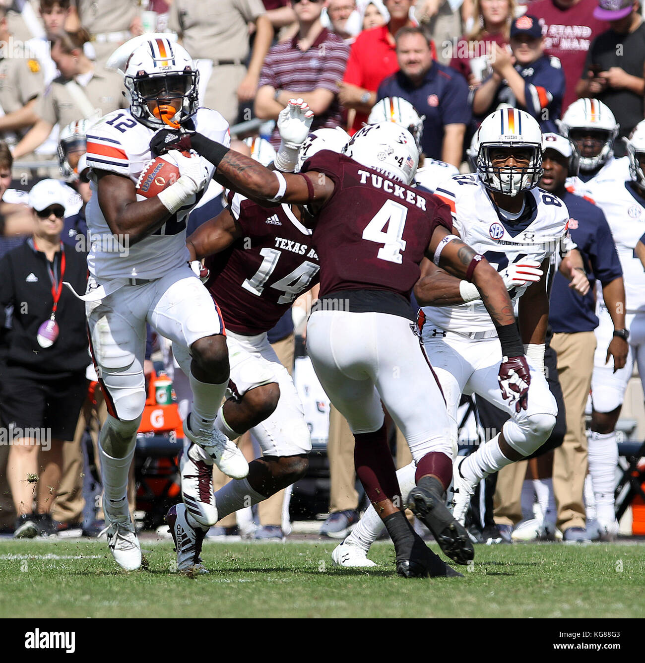 November 4, 2017: Auburn Tigers wide receiver Eli Stove (12) rushes past the tackle of Texas A&M Aggies defensive back Derrick Tucker (4) in the third quarter during the NCAA football game between the Auburn Tigers and the Texas A&M Aggies at Kyle Field in College Station, TX; John Glaser/CSM. Stock Photo