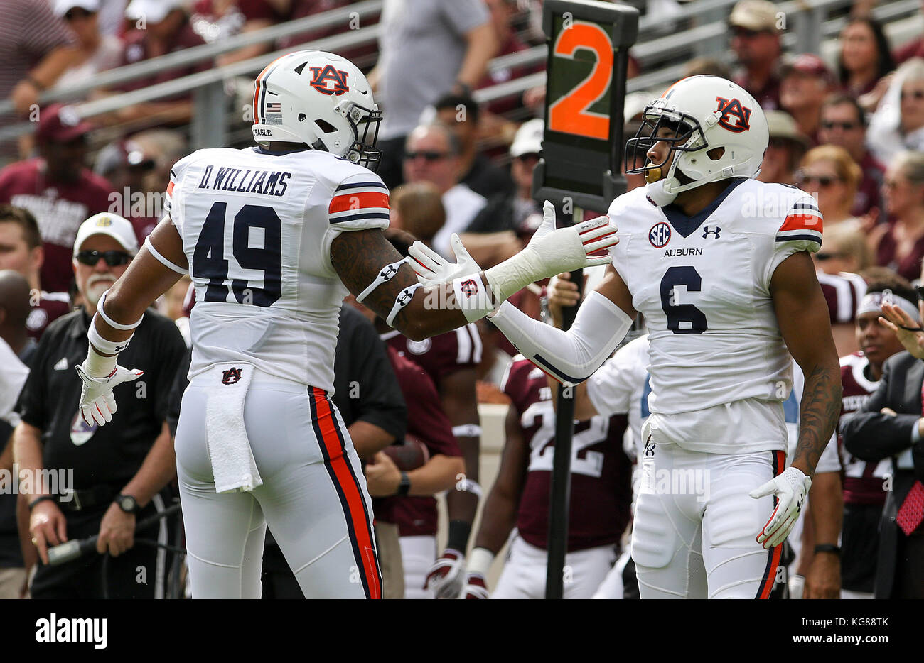 November 4, 2017: Auburn Tigers linebacker Darrell Williams (49) and defensive back Carlton Davis (6) celebrate after a tackle in the second quarter during the NCAA football game between the Auburn Tigers and the Texas A&M Aggies at Kyle Field in College Station, TX; John Glaser/CSM. Stock Photo