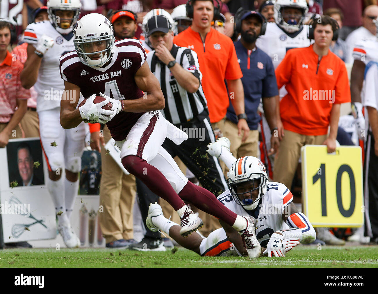 November 4, 2017: Texas A&M Aggies wide receiver Damion Ratley (4) gets past the tackle of Auburn Tigers defensive back Jamel Dean (12) during the NCAA football game between the Auburn Tigers and the Texas A&M Aggies at Kyle Field in College Station, TX; John Glaser/CSM. Stock Photo
