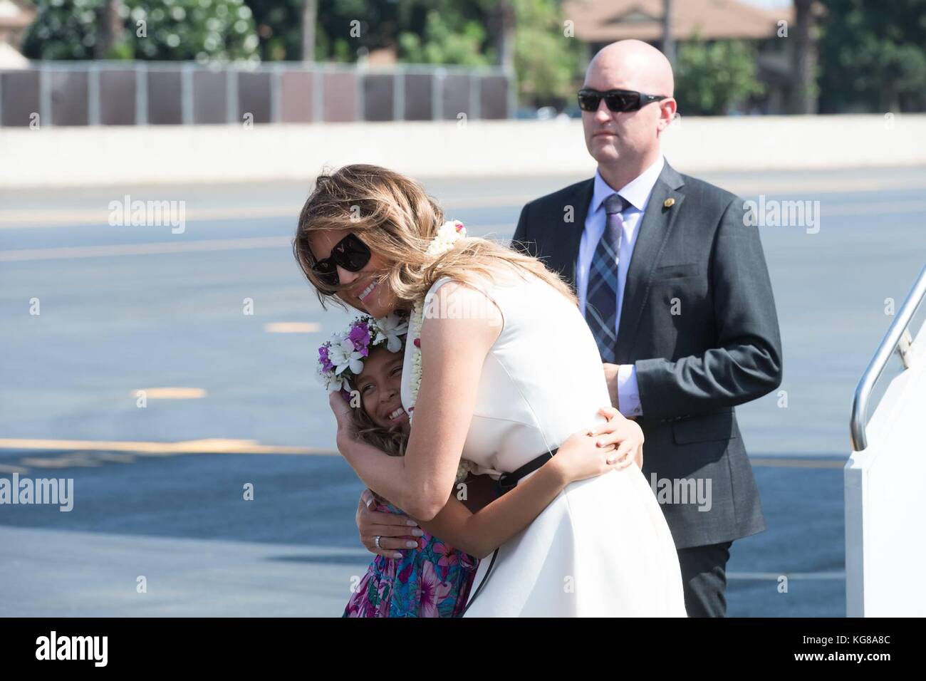 Honolulu, United States Of America. 04th Nov, 2017. U.S First Lady Melania Trump hugs a Hawaiian child that greeted her with a flower Lei during a visit to Joint Base Pearl Harbor Hickam November 3, 2017 in Honolulu, Hawaii. Credit: Planetpix/Alamy Live News Stock Photo