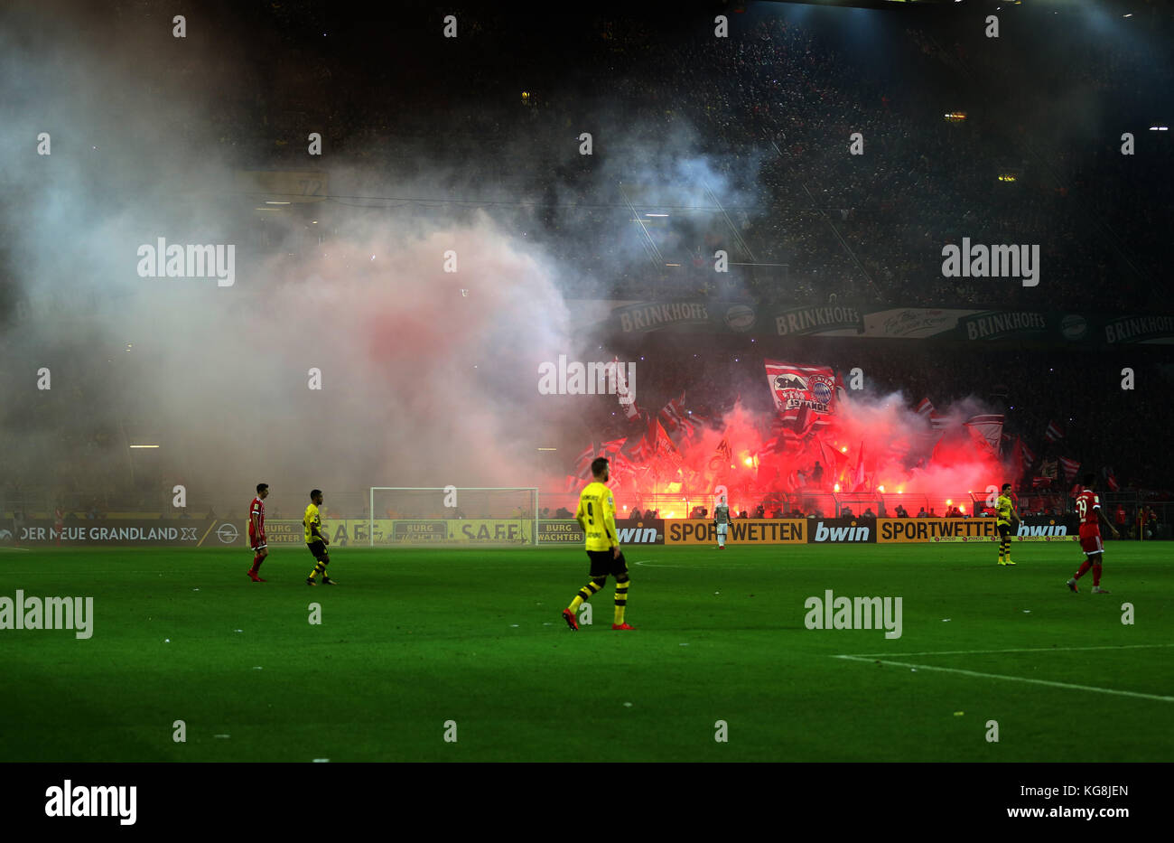 Dortmund, Germany. 04th Nov, 2017. Bayern's fans light flares during