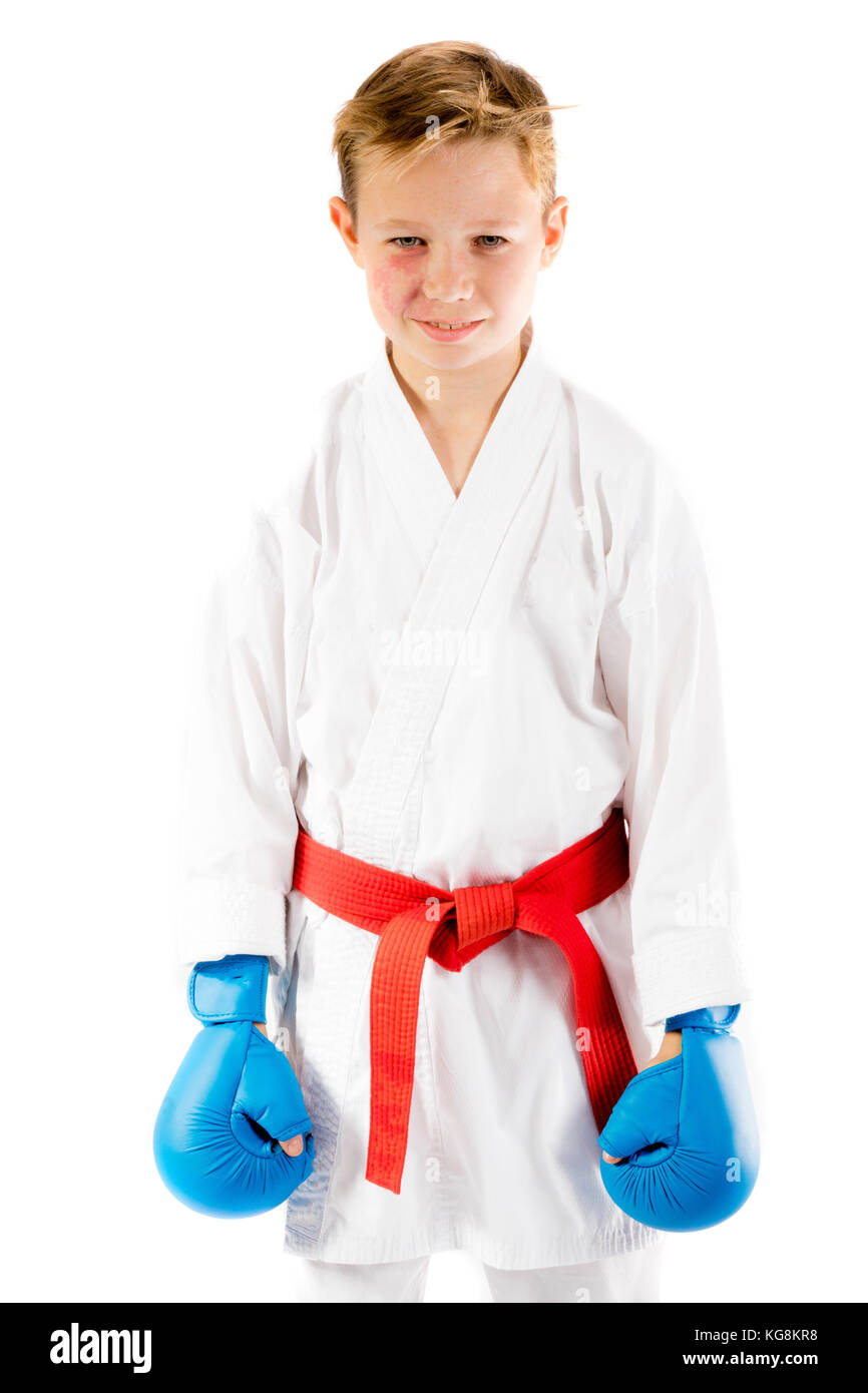 Pre-teen boy doing karate on a white background Stock Photo