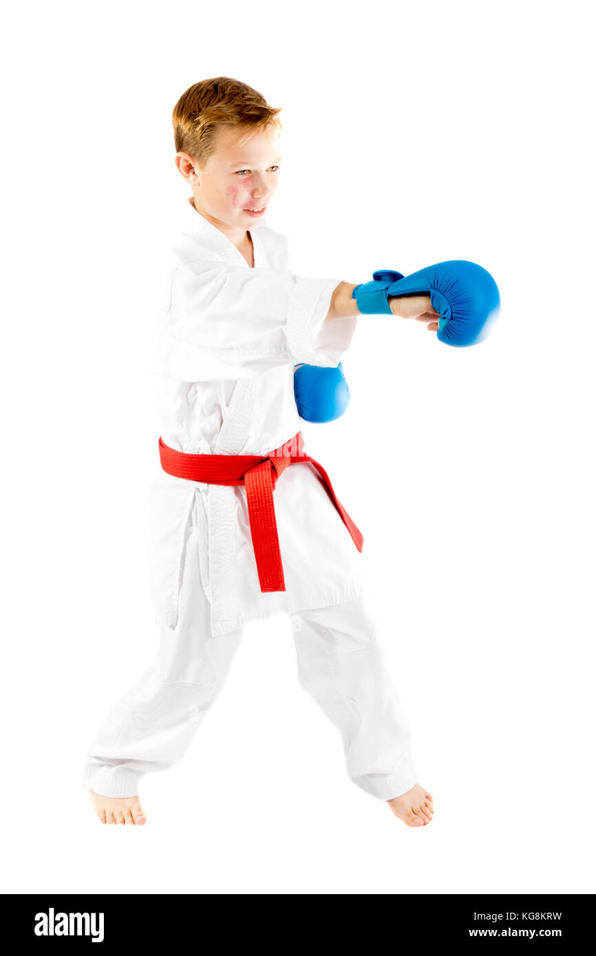 Pre-teen boy doing karate on a white background Stock Photo