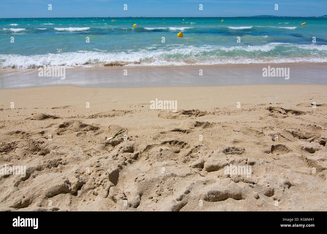 Fine sandy beach and water closeup on a sunny summer day in Es Trenc Mallorca, Balearic islands, Spain. Stock Photo