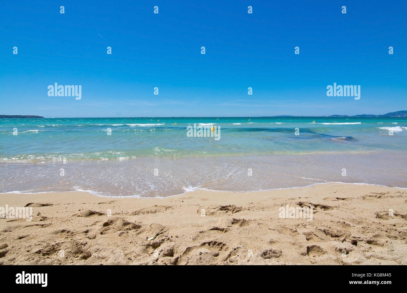 Fine sandy beach and water closeup on a sunny summer day in Es Trenc Mallorca, Balearic islands, Spain. Stock Photo
