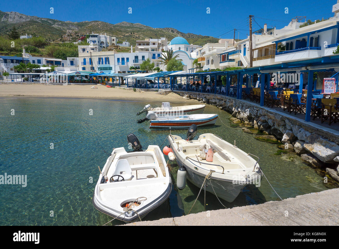 Fishing boats at the harbour of the village Apollonas, North side of ...