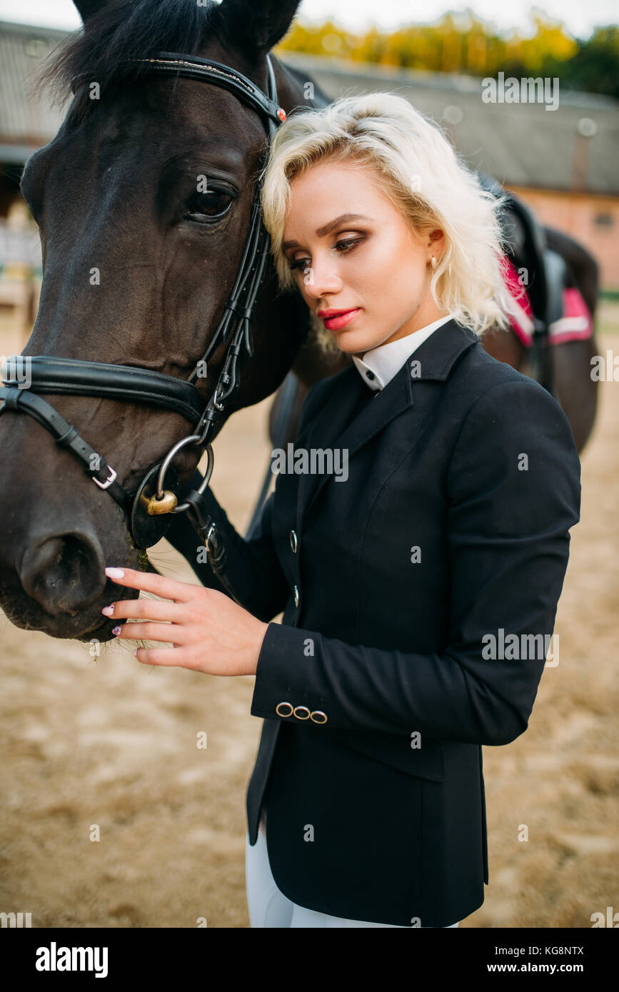 Portrait Of Blonde Woman With Horse Horseback Riding Brown Stallion