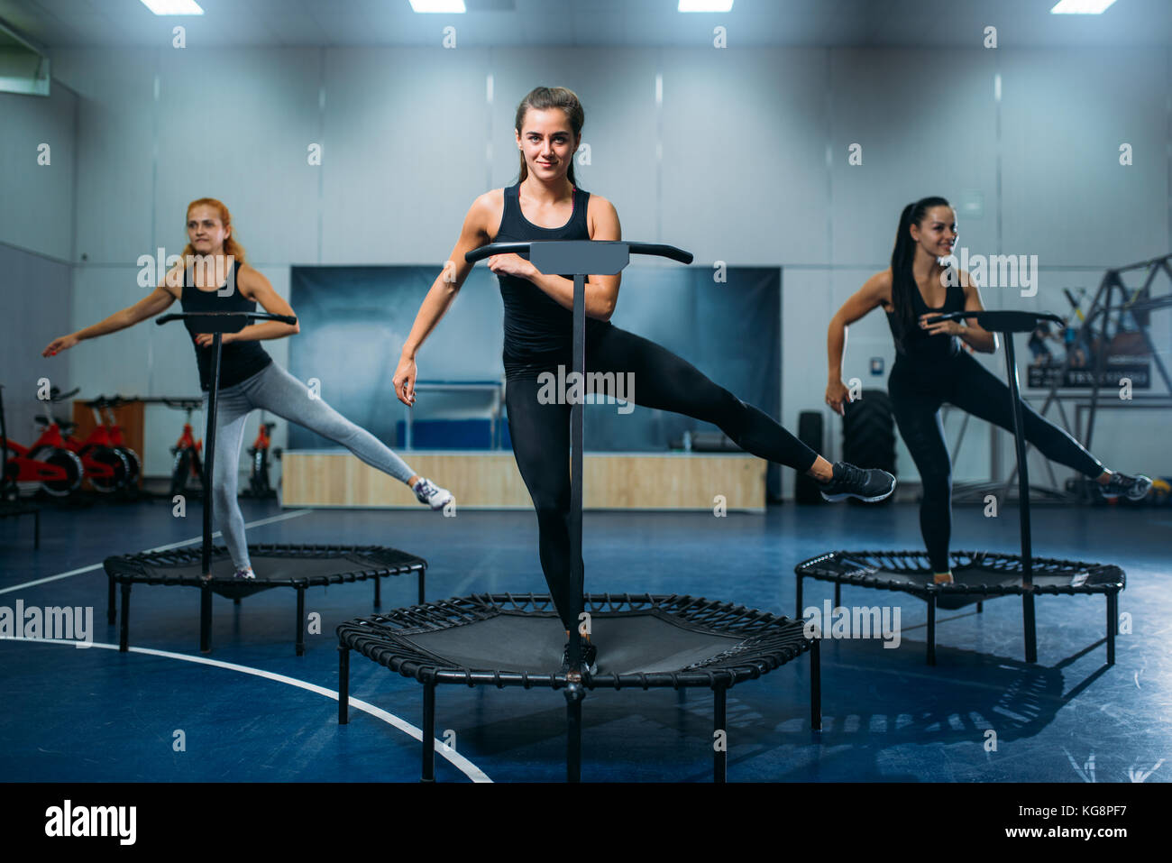 Women group on sport trampoline, fitness workout. Female teamwork in gym.  Aerobic class Stock Photo - Alamy