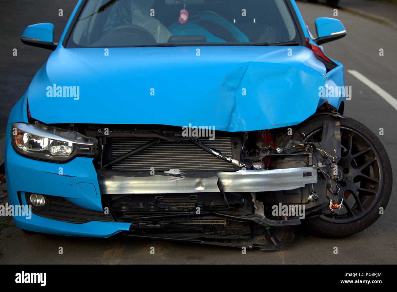 car crash car damaged front wheel at right angle Stock Photo