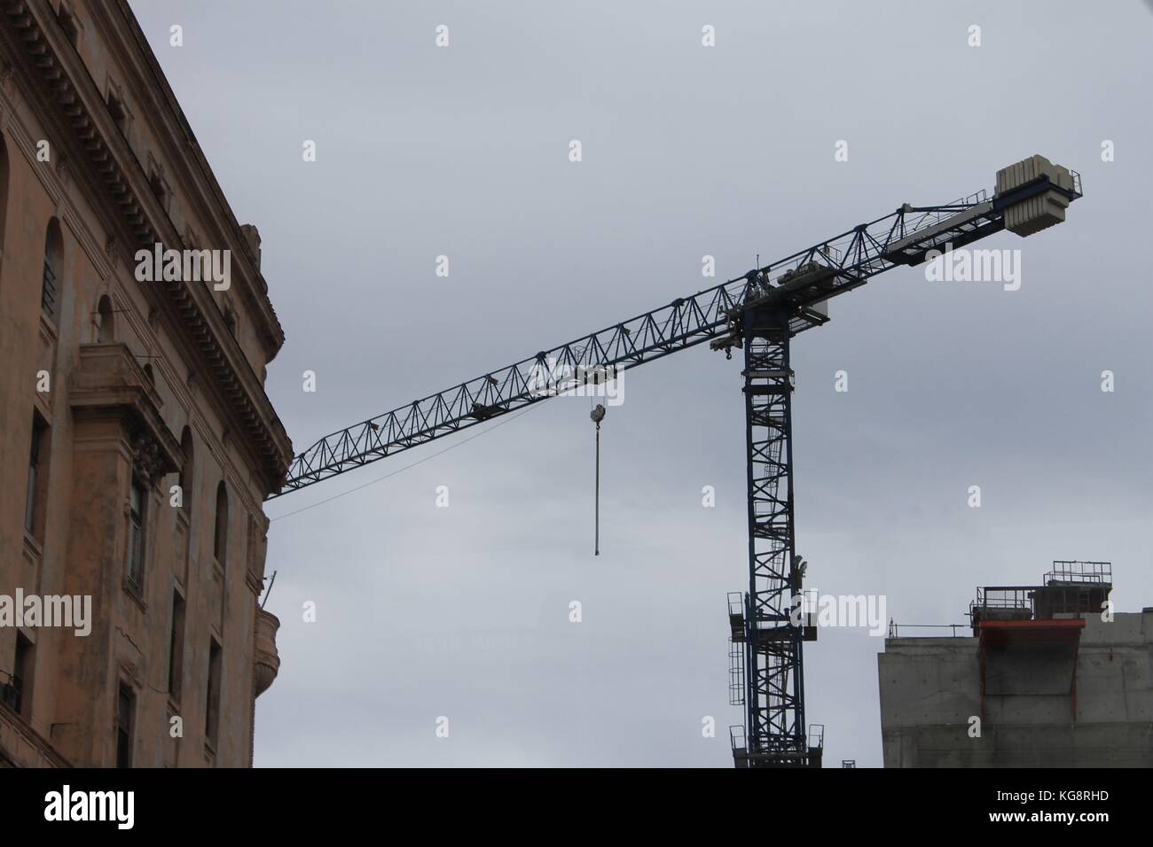 A crane working on a construction project, Havana, Cuba. Stock Photo