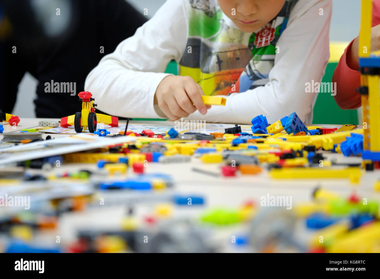 Child plays with a builder kit Stock Photo - Alamy