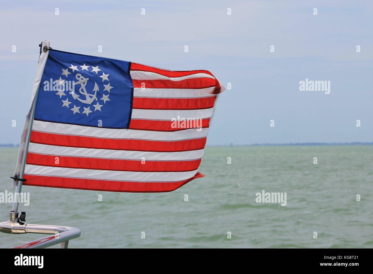 U.S. nautical flag flying on the bow rail of a yacht, Gulf of Mexico, Florida, USA. Stock Photo