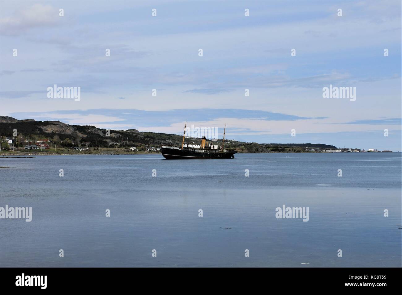 Looking across the harbor at the old grounded ship, the Kylie, Harbour