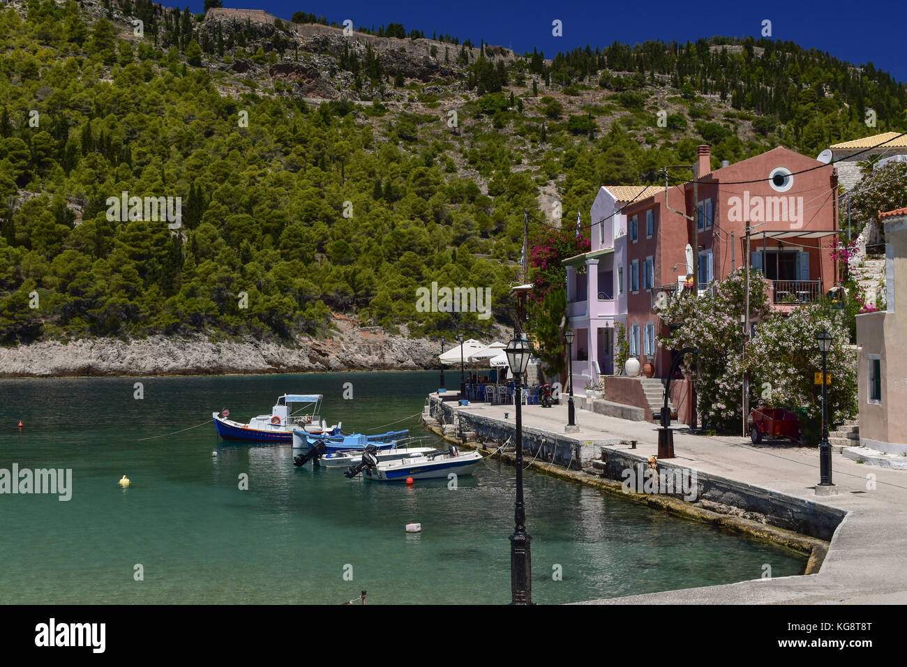 Boats moored alongside the quay in Asos, Cephalonia, Greece Stock Photo