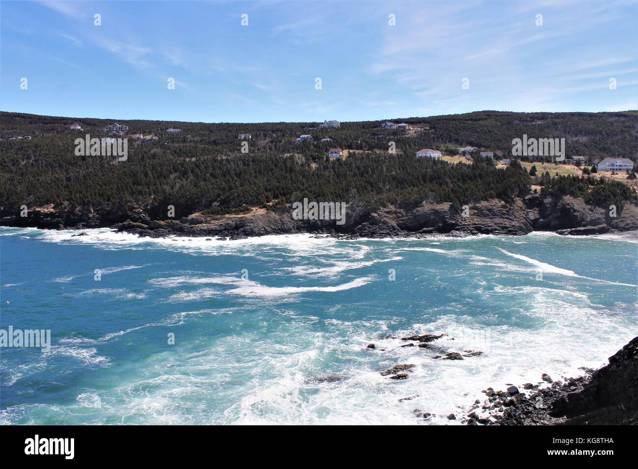 Waves breaking against the rocky cliffs and rugged coastline, Logy Bay-Middle Cove-Outer Cove, Newfoundland Labrador Stock Photo