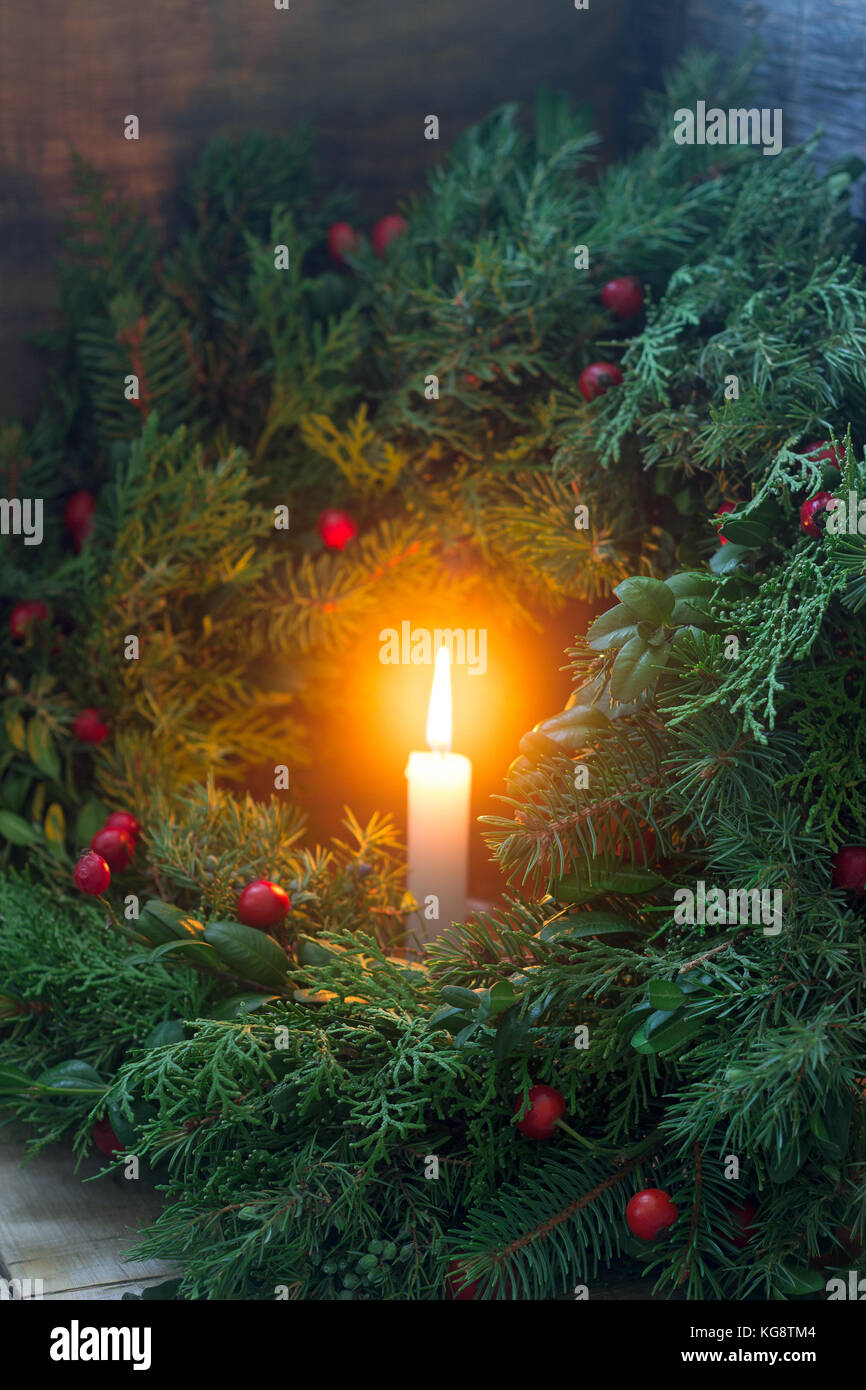 A Christmas wreath made of fir branches, juniper, tuja, boxwood and ...