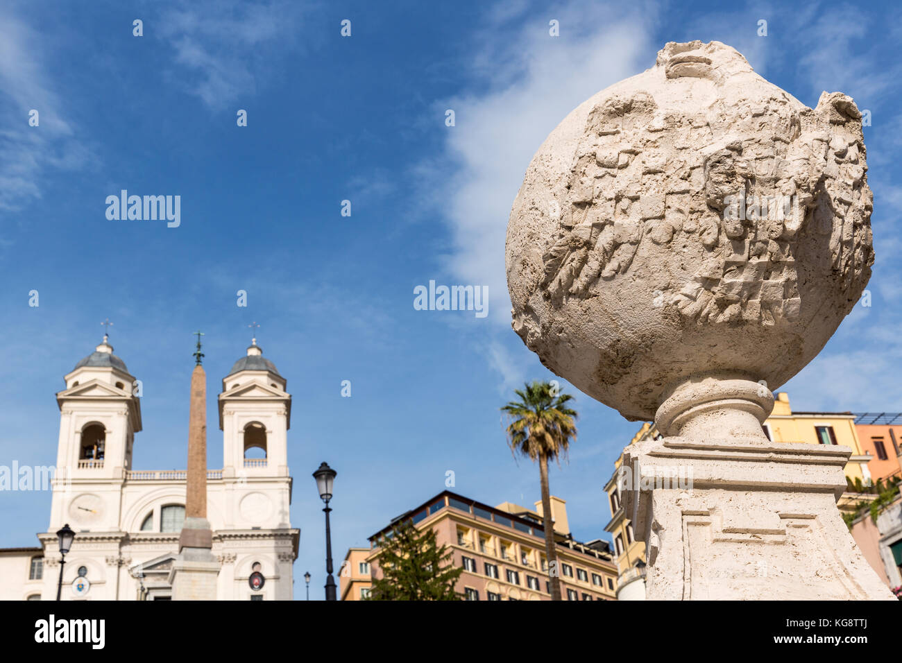 Details from the Spanish steps stair rail and the church of the Santissima Trinità dei Monti in the background, Rome, Italy Stock Photo
