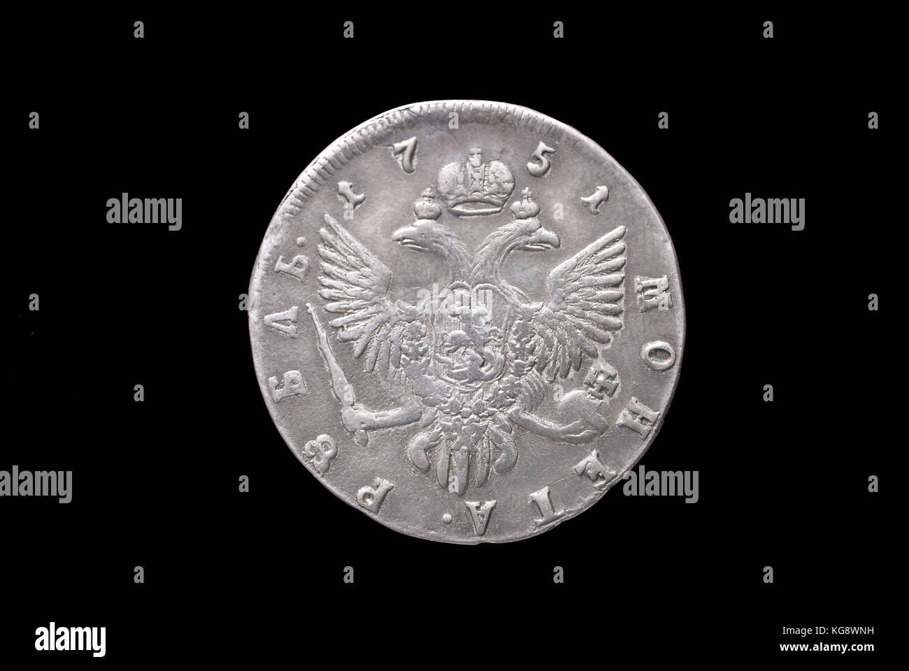 Russian ancient silver coin (empress Elizabeth II, 1 rouble, 1751).Reverse (of coin). Stock Photo
