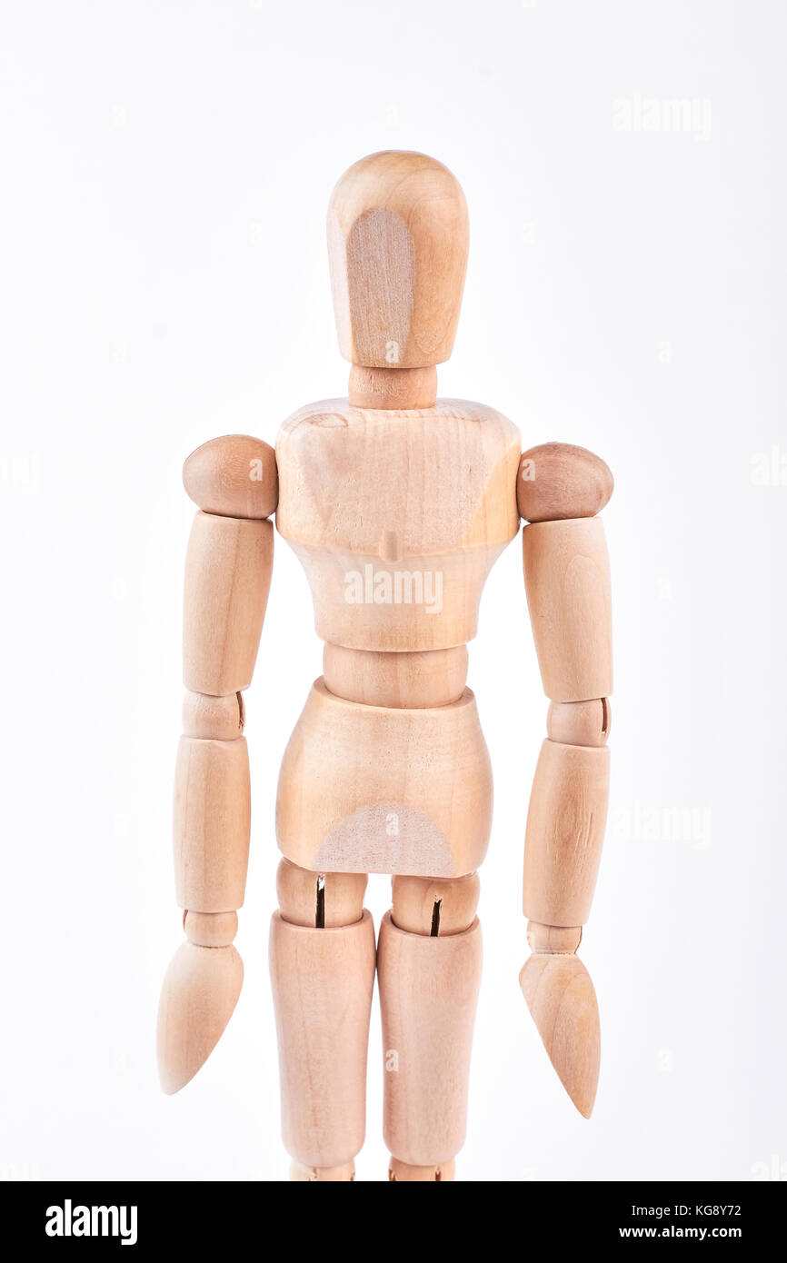 Human wooden dummy standing over white Stock Photo Alamy