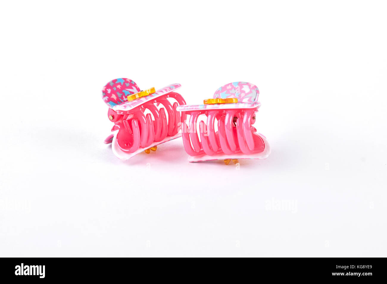 Colorful hair clips on white background Stock Photo - Alamy