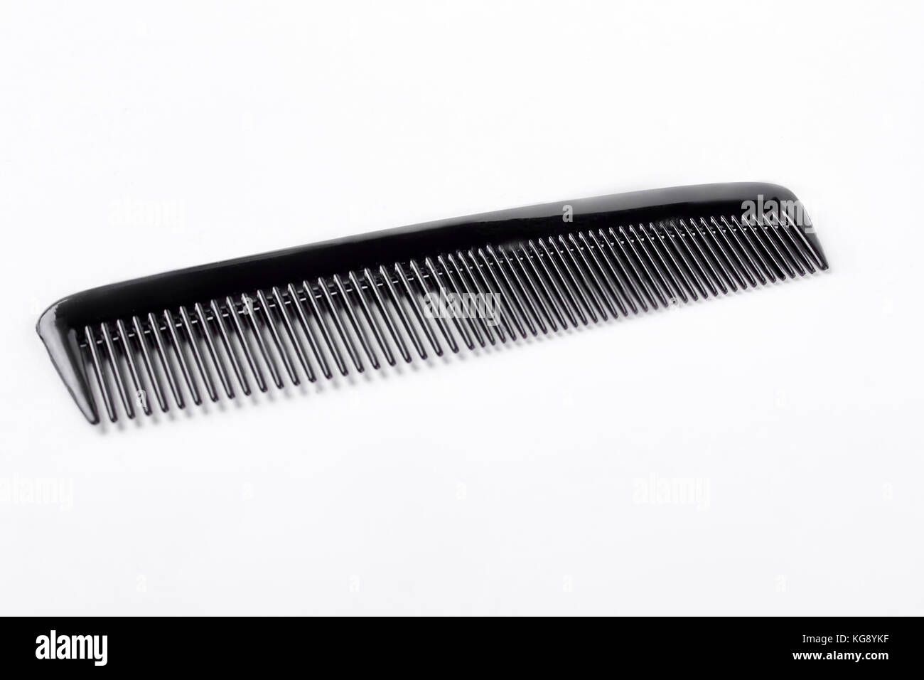 Black plastic comb on white background Stock Photo Alamy