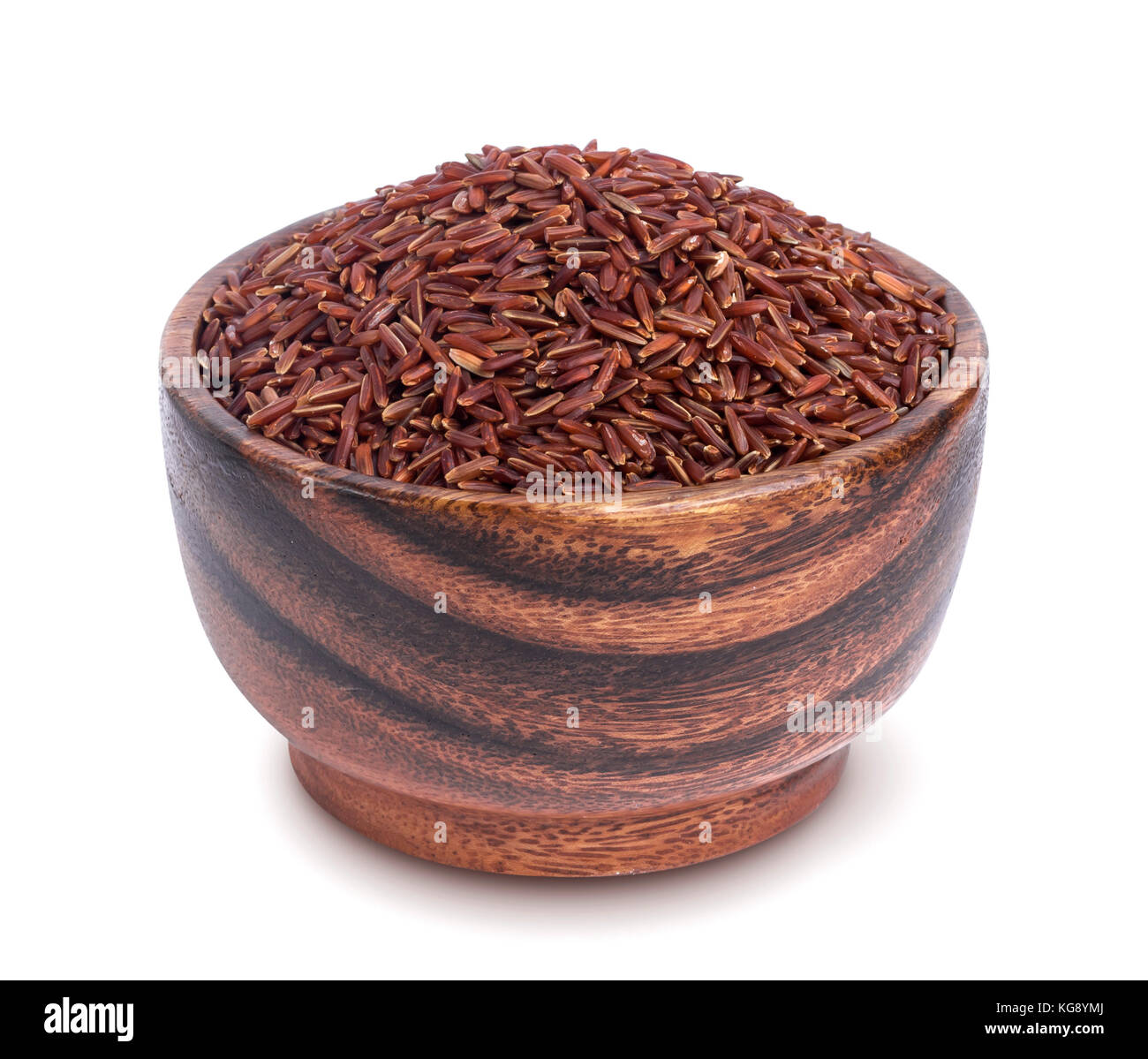 Red rice in wooden bowl isolated on white background Stock Photo