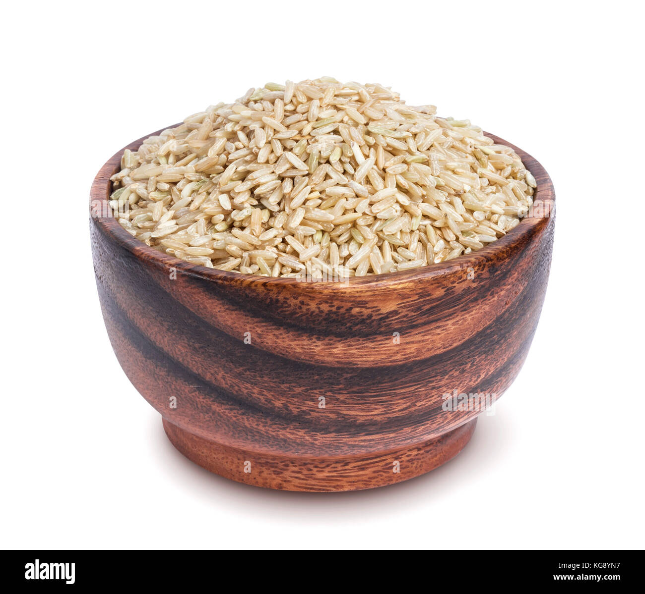 Brown rice in wooden bowl isolated on white background Stock Photo