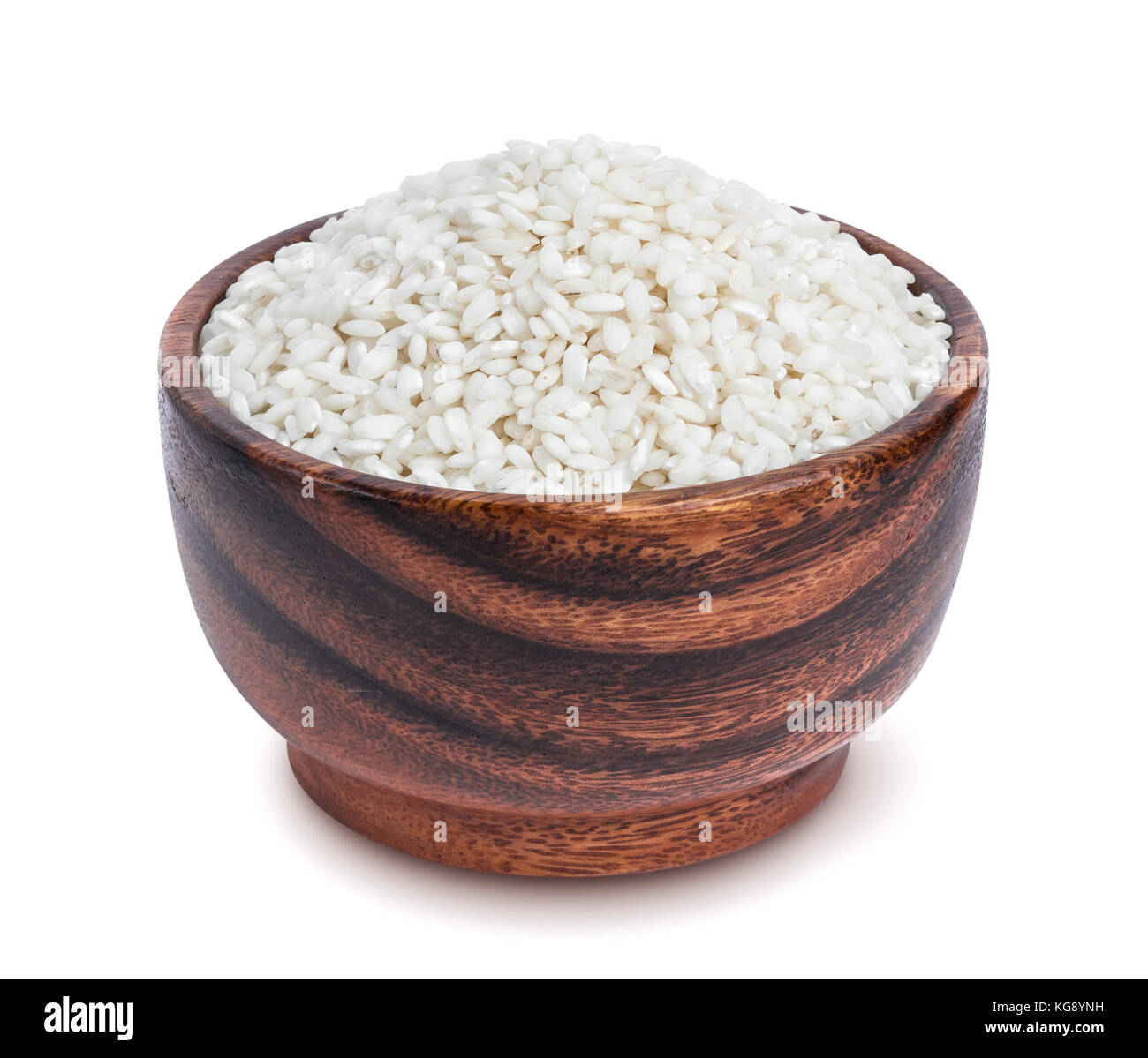 Risotto rice in wooden bowl isolated on white background Stock Photo