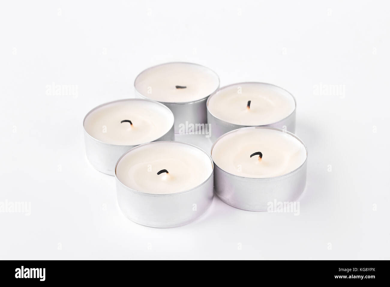 Set of five round tea light candles Stock Photo Alamy
