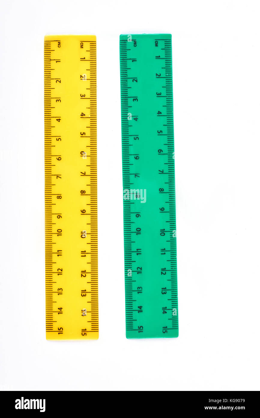 Yellow and green plastic rulers. Stock Photo
