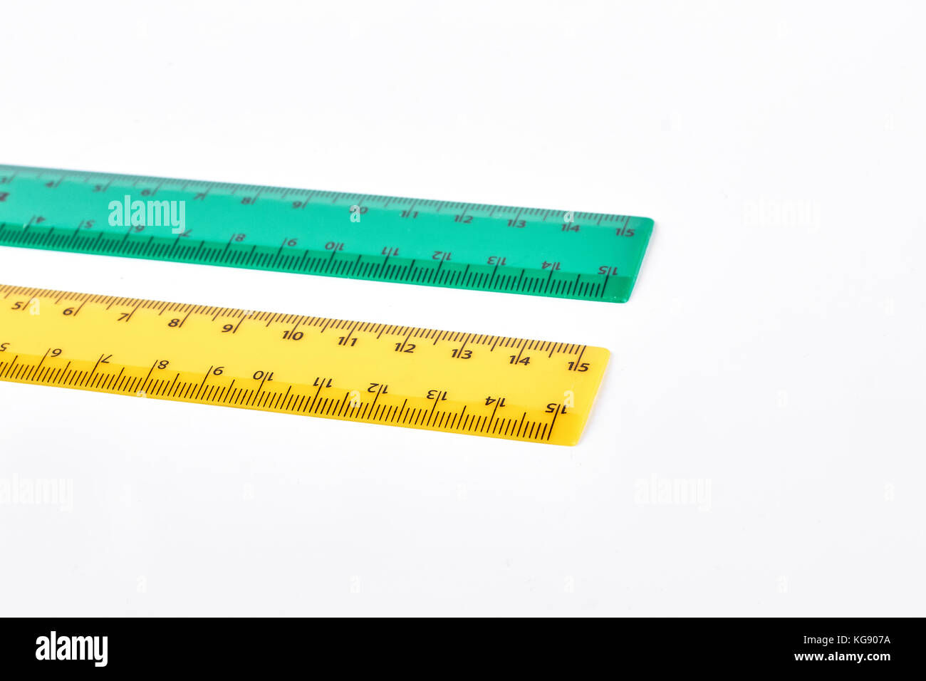 Two colorful rulers, white background. Stock Photo