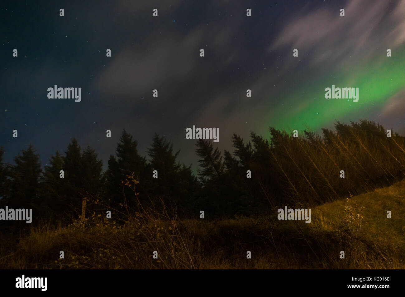 Northern lights Aurora Borealis above landscape in Iceland Stock Photo ...