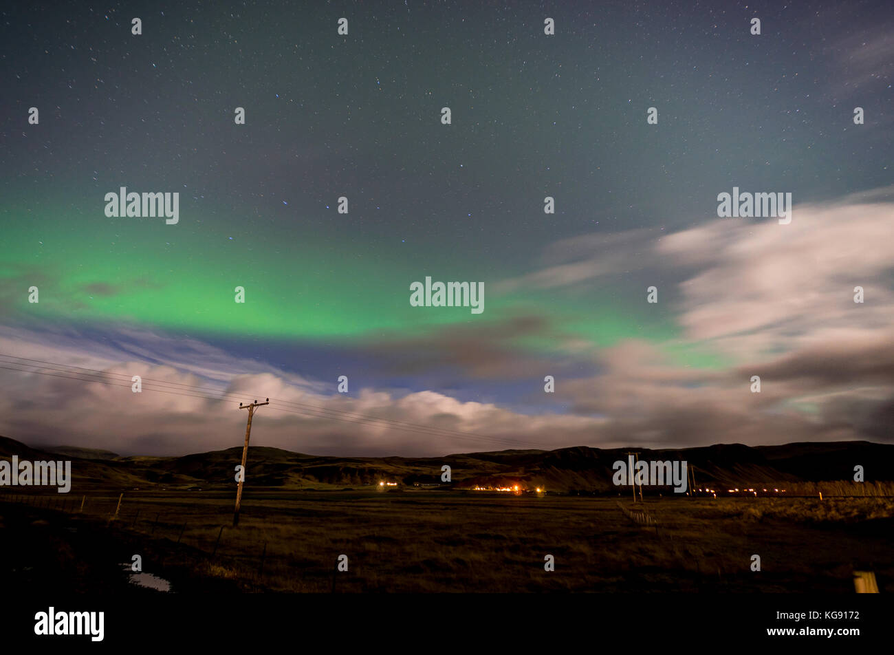 Northern lights Aurora Borealis above landscape in Iceland Stock Photo ...