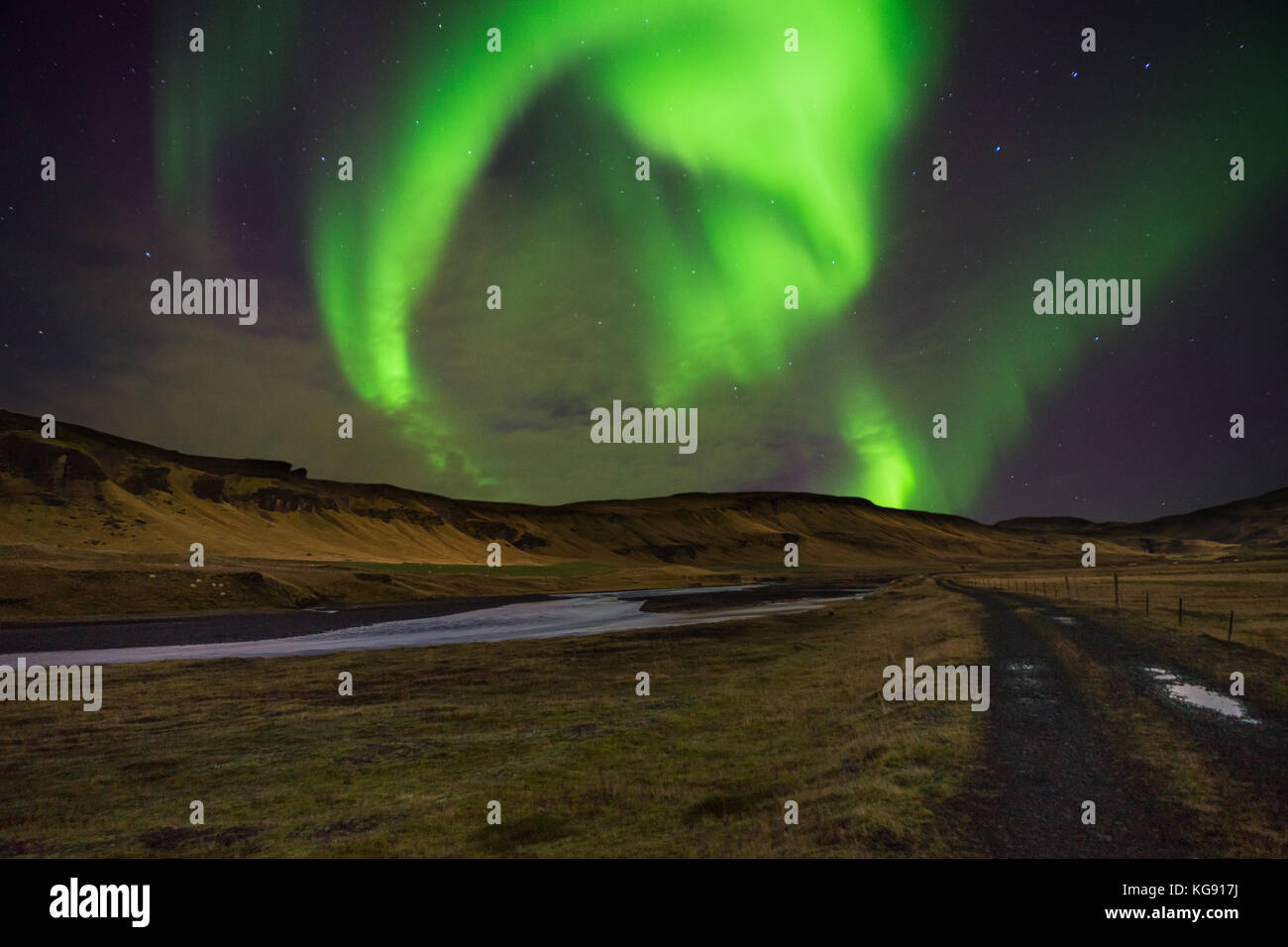 Northern lights Aurora Borealis above landscape in Iceland Stock Photo ...