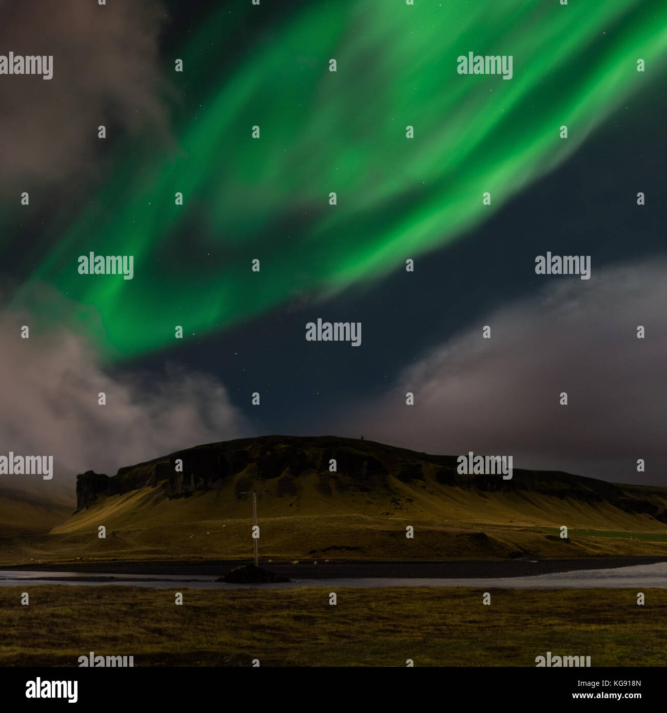 Northern lights Aurora Borealis above landscape in Iceland Stock Photo ...