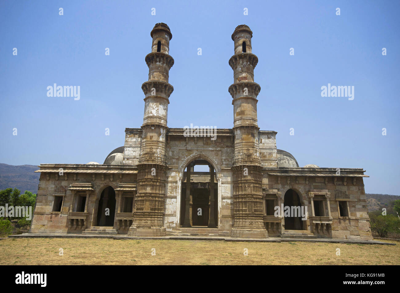 Outer view of Kevada Masjid (Mosque), has minarets, globe like domes and narrow stairs. Built in Champaner during the time of Mahmud Begada, UNESCO pr Stock Photo