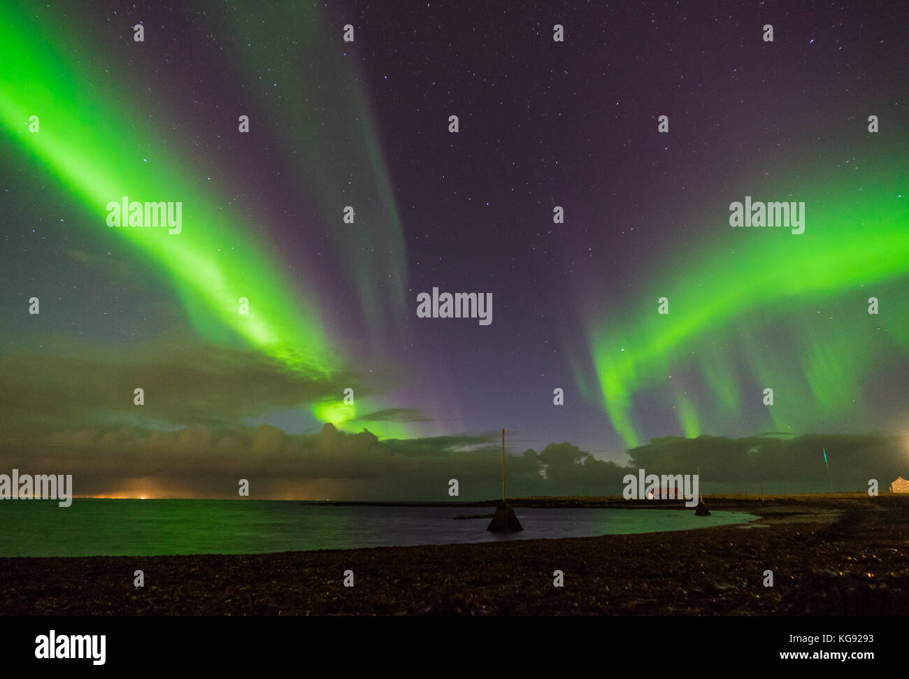 Northern lights Aurora Borealis above landscape in Iceland Stock Photo ...