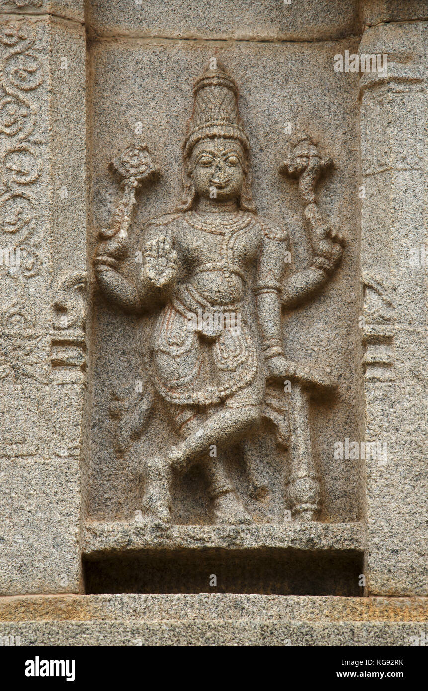 Carving details on the outer wall of Hazara Rama Temple. Hampi, Karnataka, India. Famous for the lovely bas relics and panels depicting the story of t Stock Photo