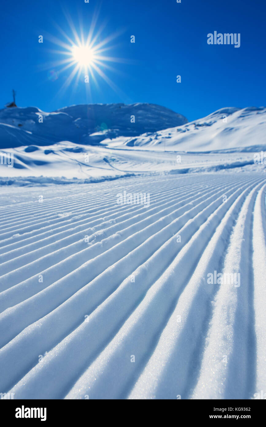 Snow path ski track surface, corduroy texture, selective focus Stock Photo