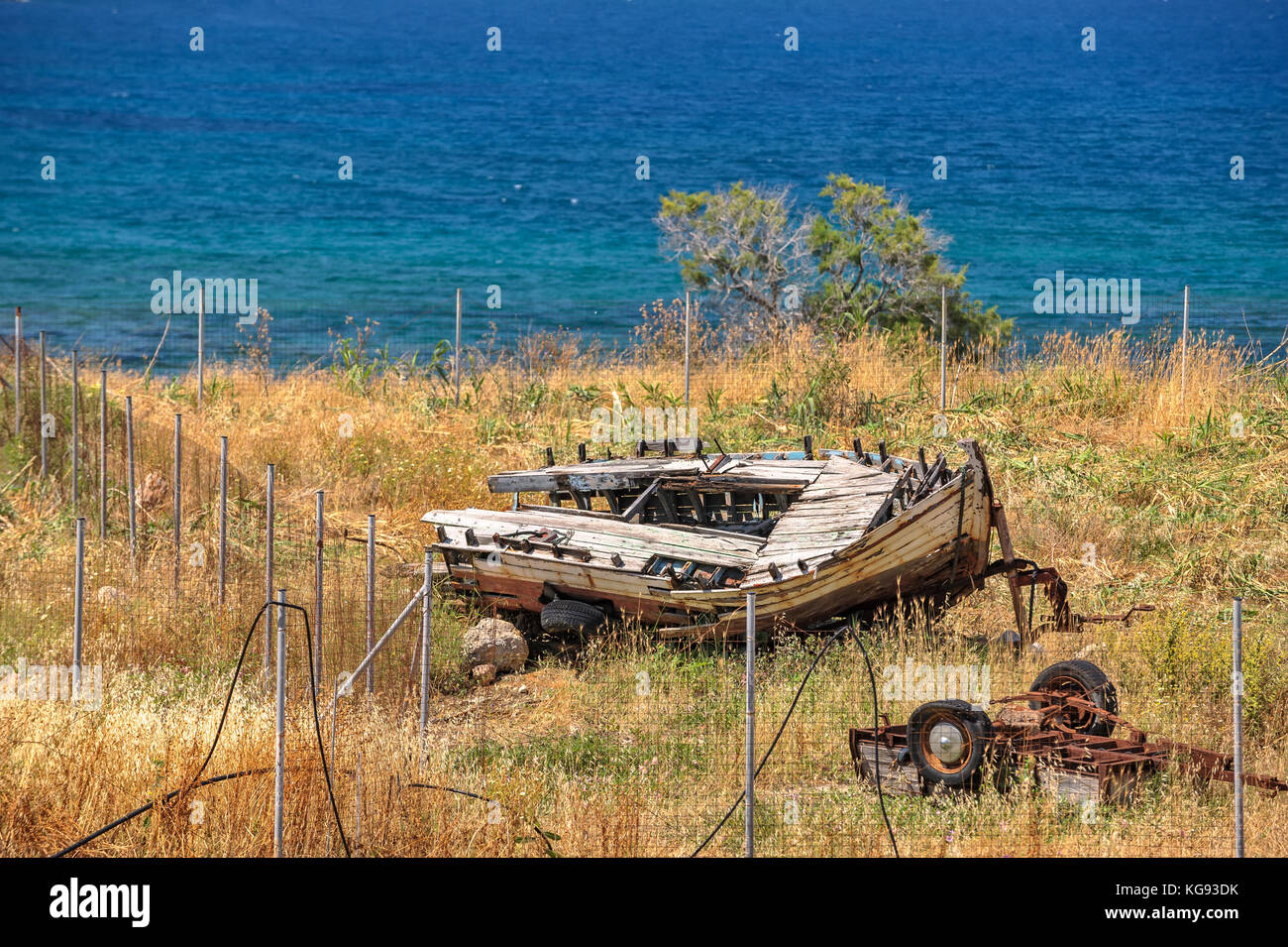 Old broken wooden boat on seashore Stock Photo - Alamy