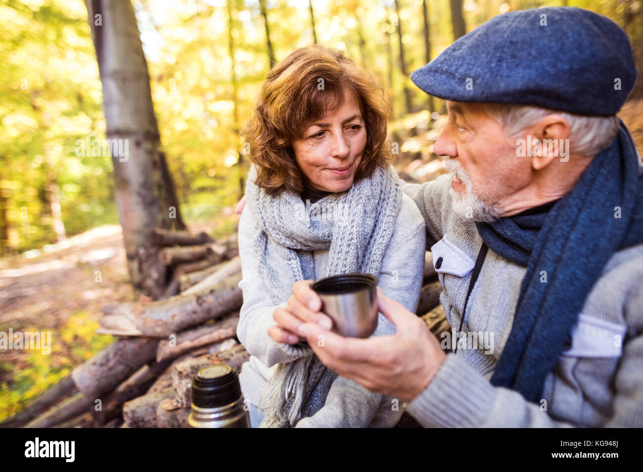 Senior couple on a walk in autumn forest Stock Photo - Alamy