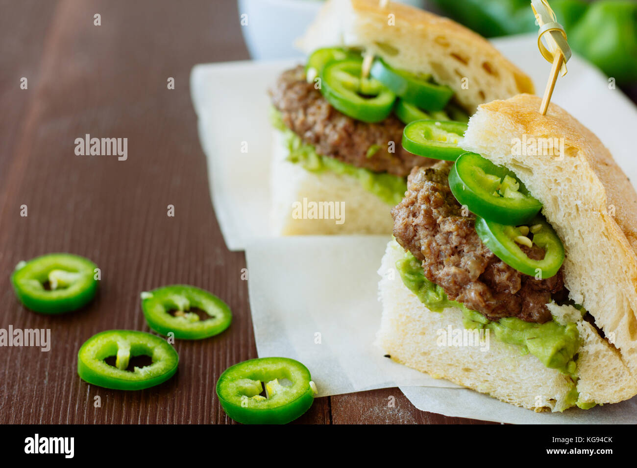 Hamburgers with avocado paste and chili selective focus Stock Photo