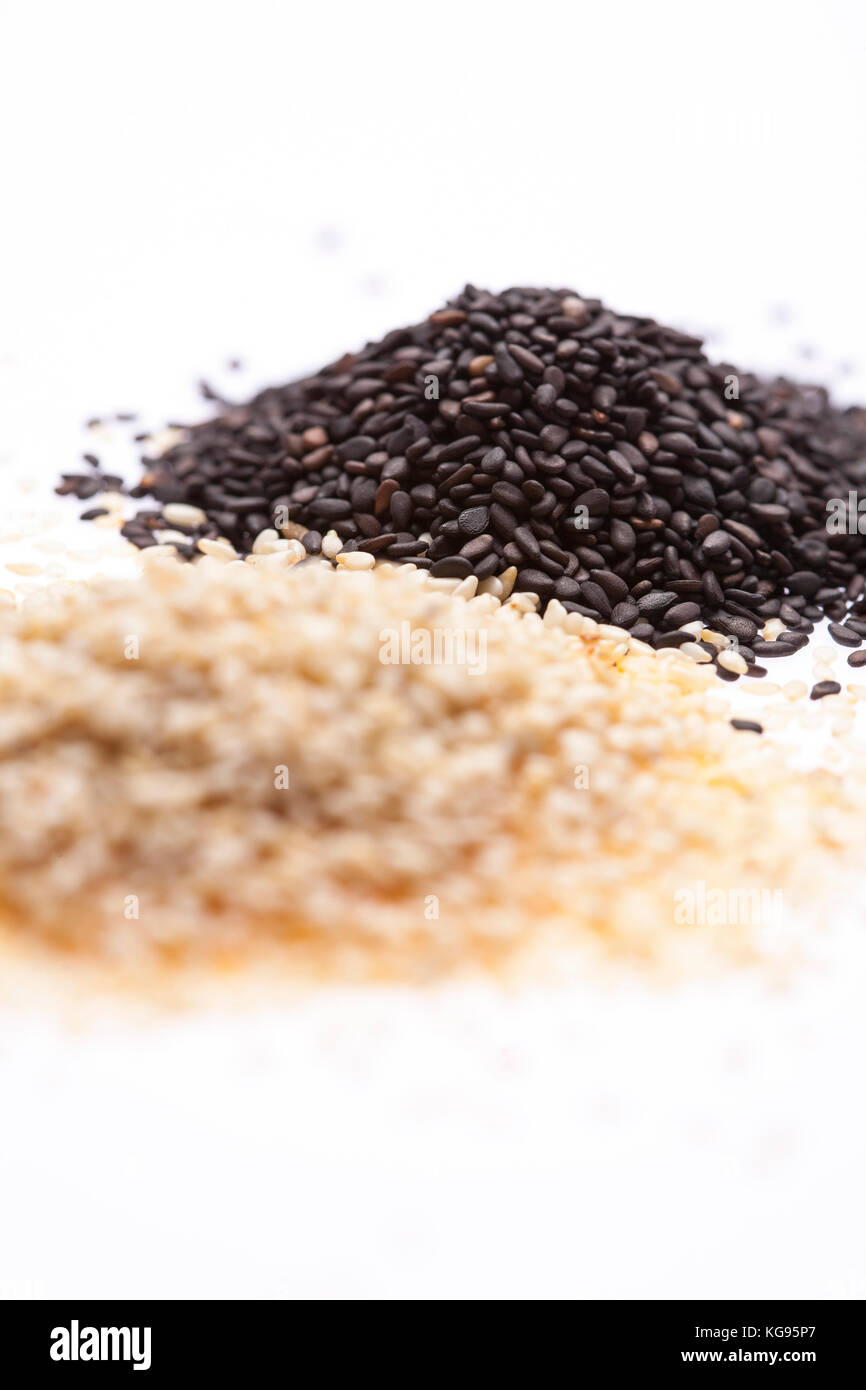 two piles of sesame seed, black in focus but white out Stock Photo Alamy
